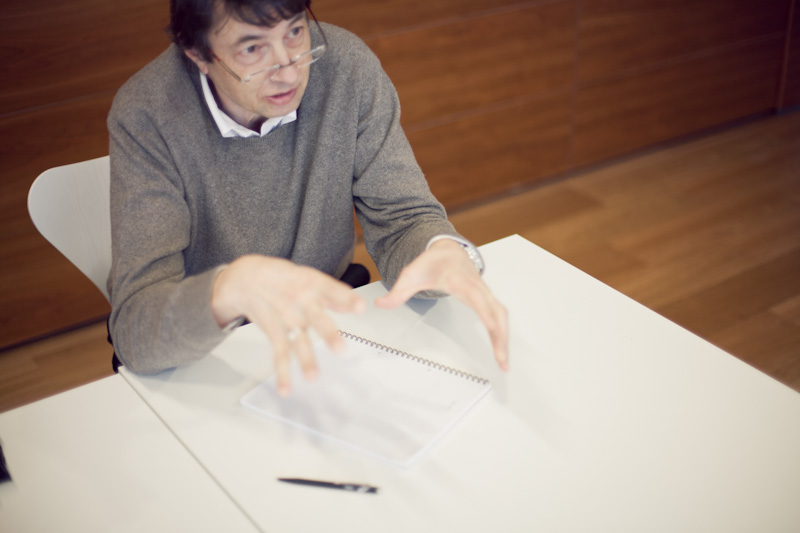 Mikael von Euler, Oncos chief medical officer, examining documents at a white table.