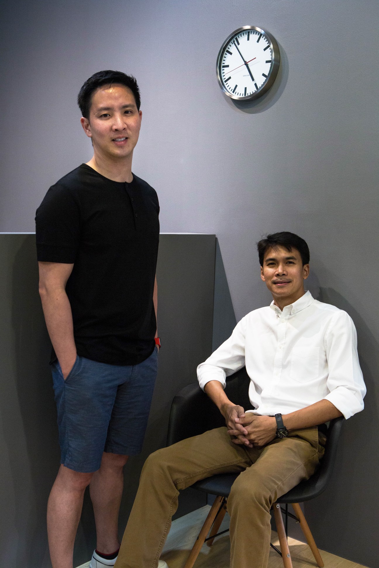 Anuthin Wongsunkakon and Pongtorn Hiranpruek, founders of Cadson Demak, in their office with wall clock