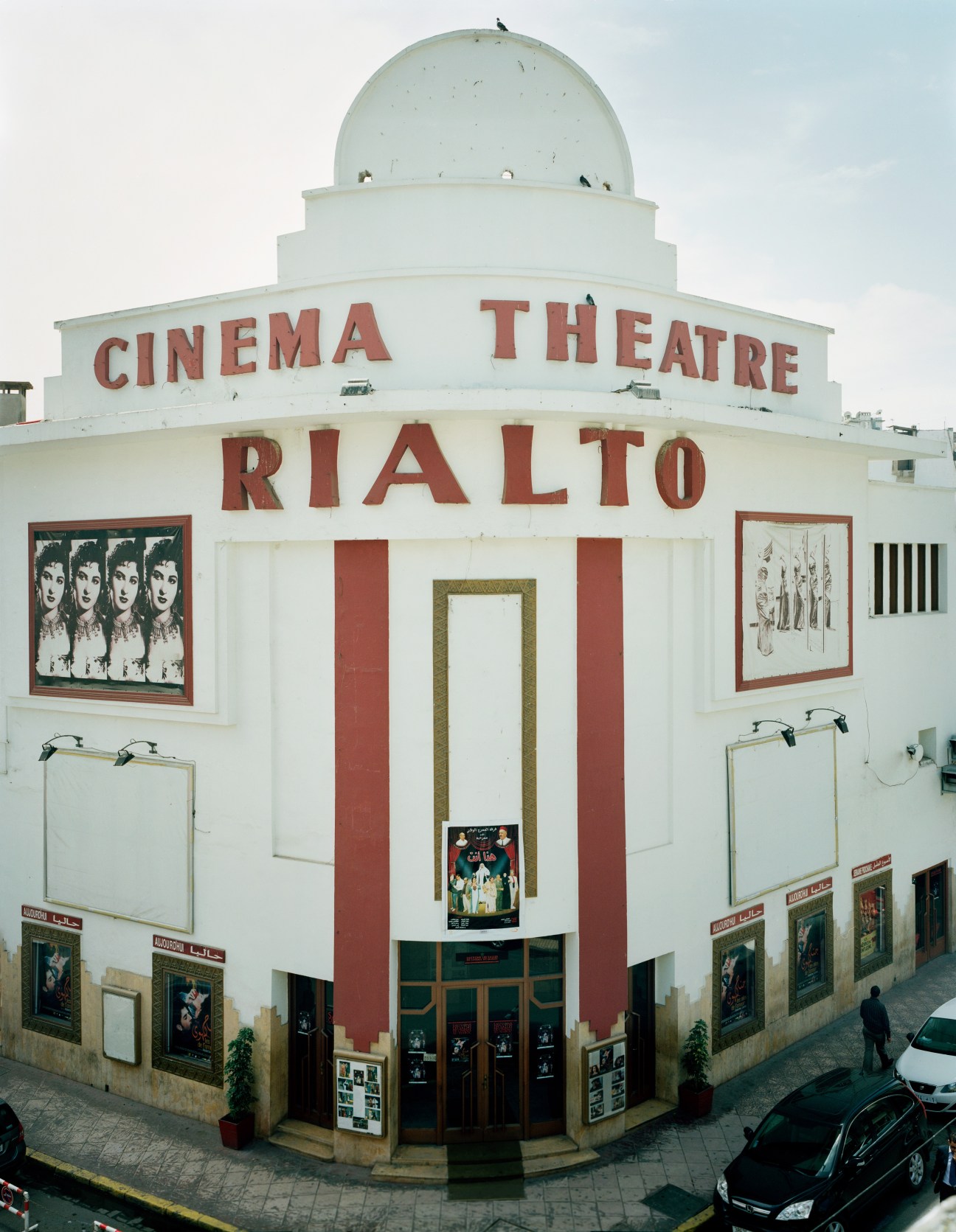 Cinema Rialto, an Art Deco theater in Casablanca with white facade, red signage, and a distinctive dome.