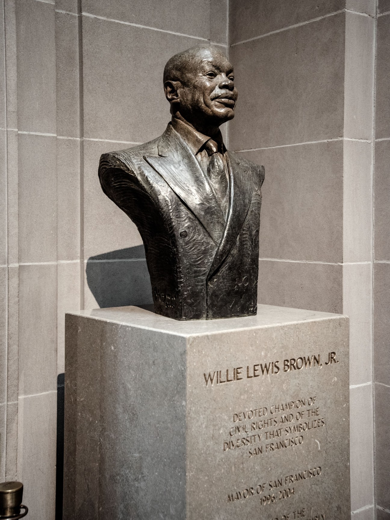 Bronze bust sculpture of Willie Lewis Brown Jr., the 41st mayor of San Francisco, displayed on a marble pedestal.