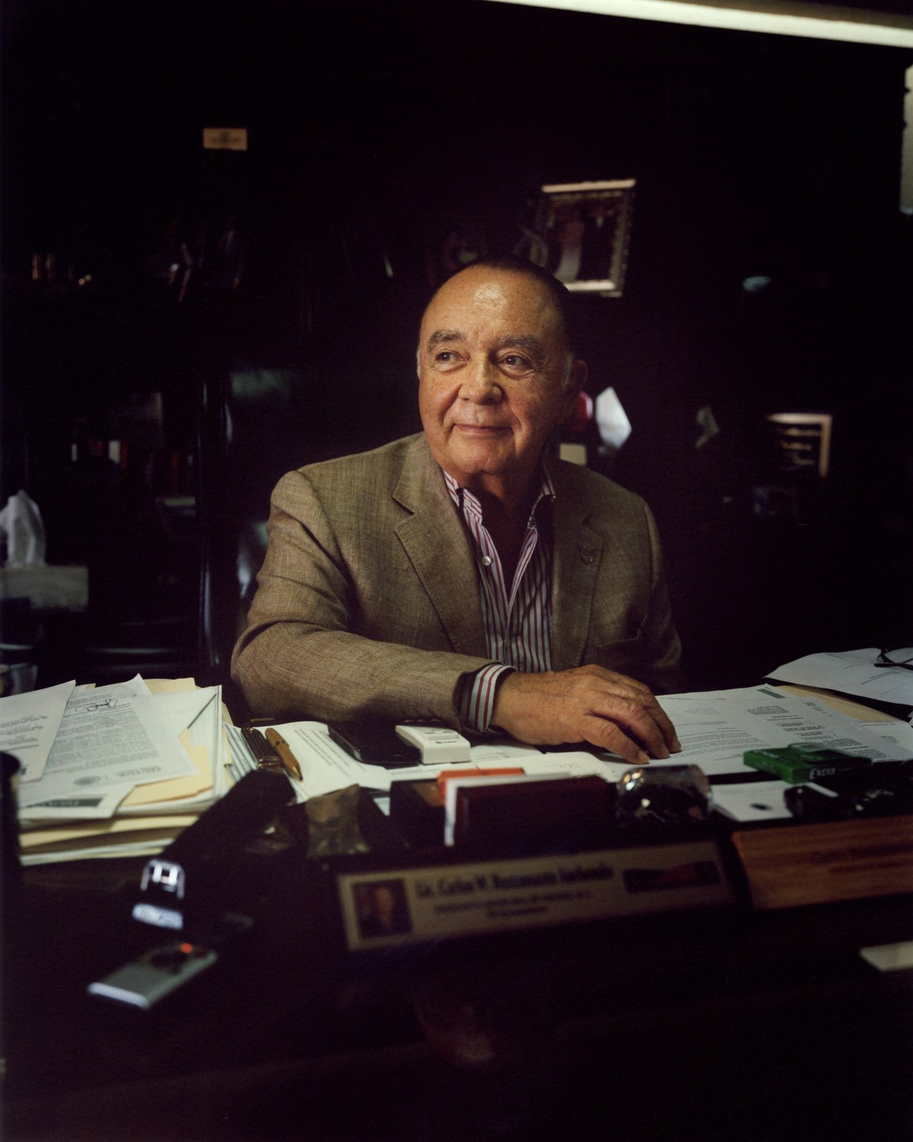 Tijuana mayor Carlos Bustamante seated at his desk in his downtown office.