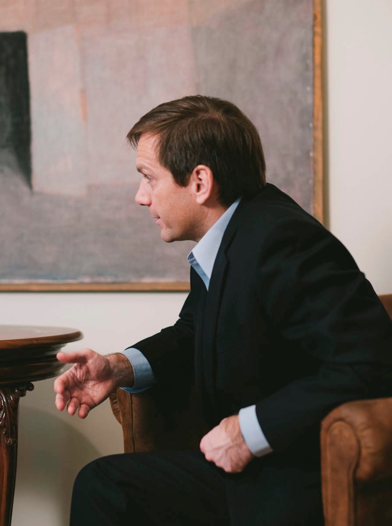 Gordon Bajnai, Hungarian opposition leader, sitting in profile wearing a dark suit and light blue shirt.