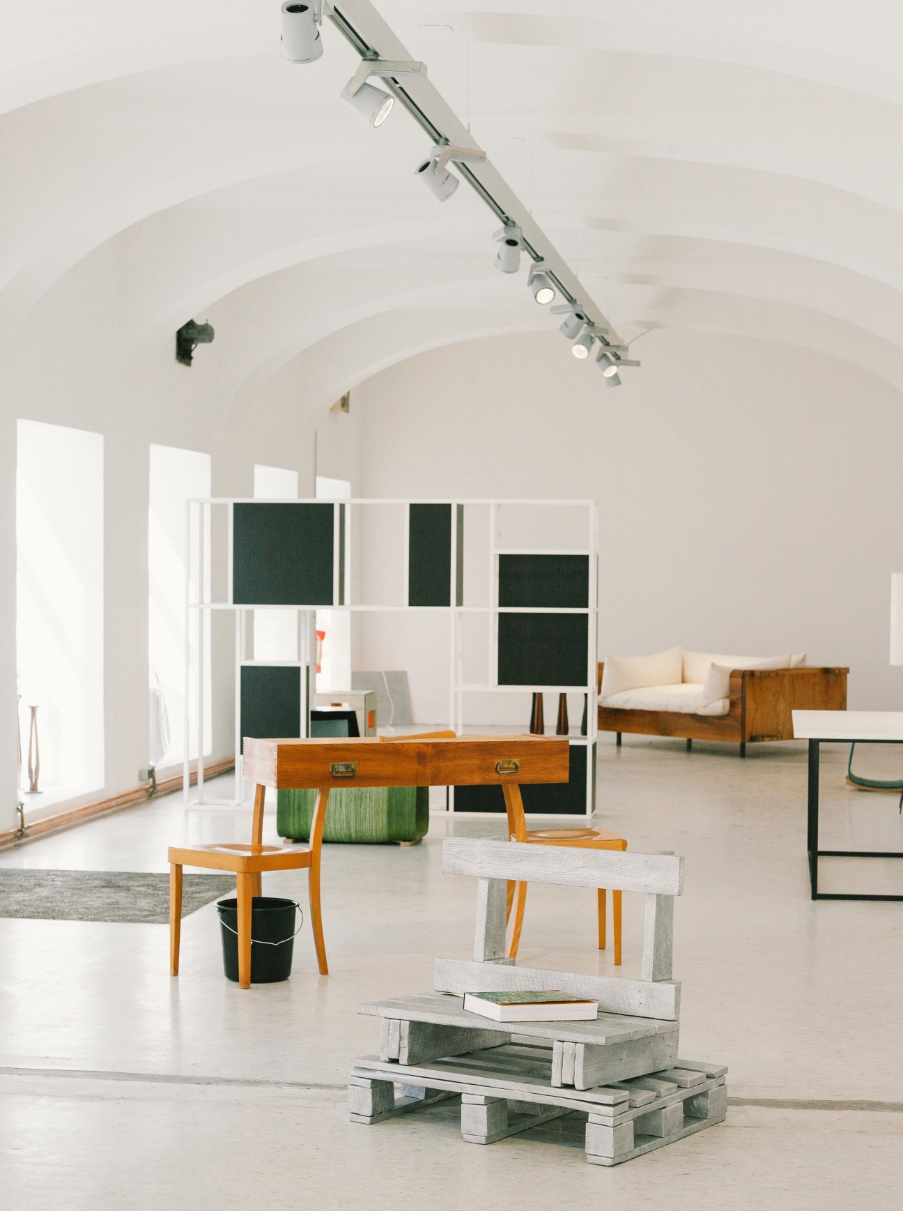 Interior of Himbeer & Soda design gallery in Vienna with minimalist furniture and artwork displays.
