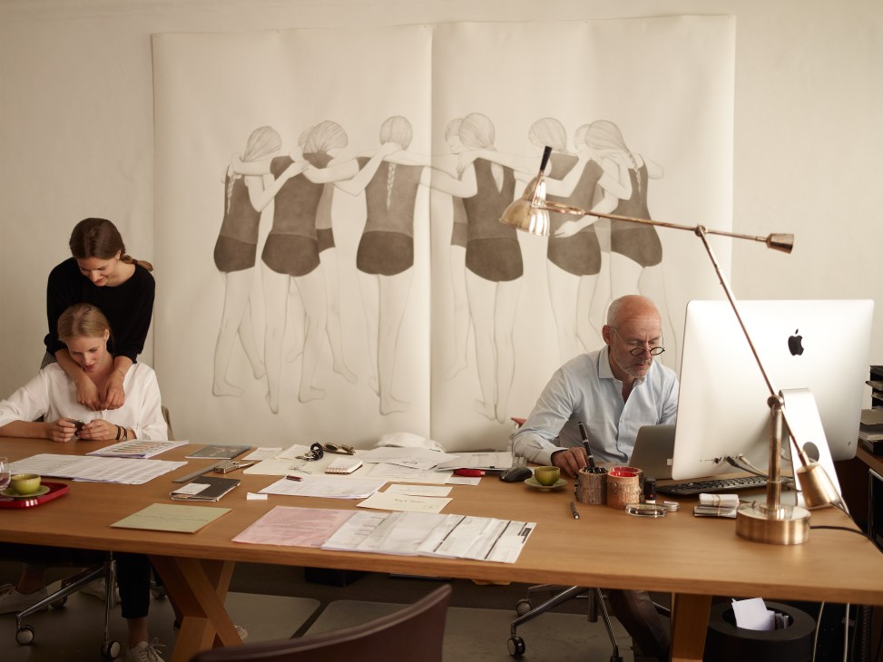 Roy Dantendorfer works at his desk with his daughters Pia and Lea in his Salzburg office.