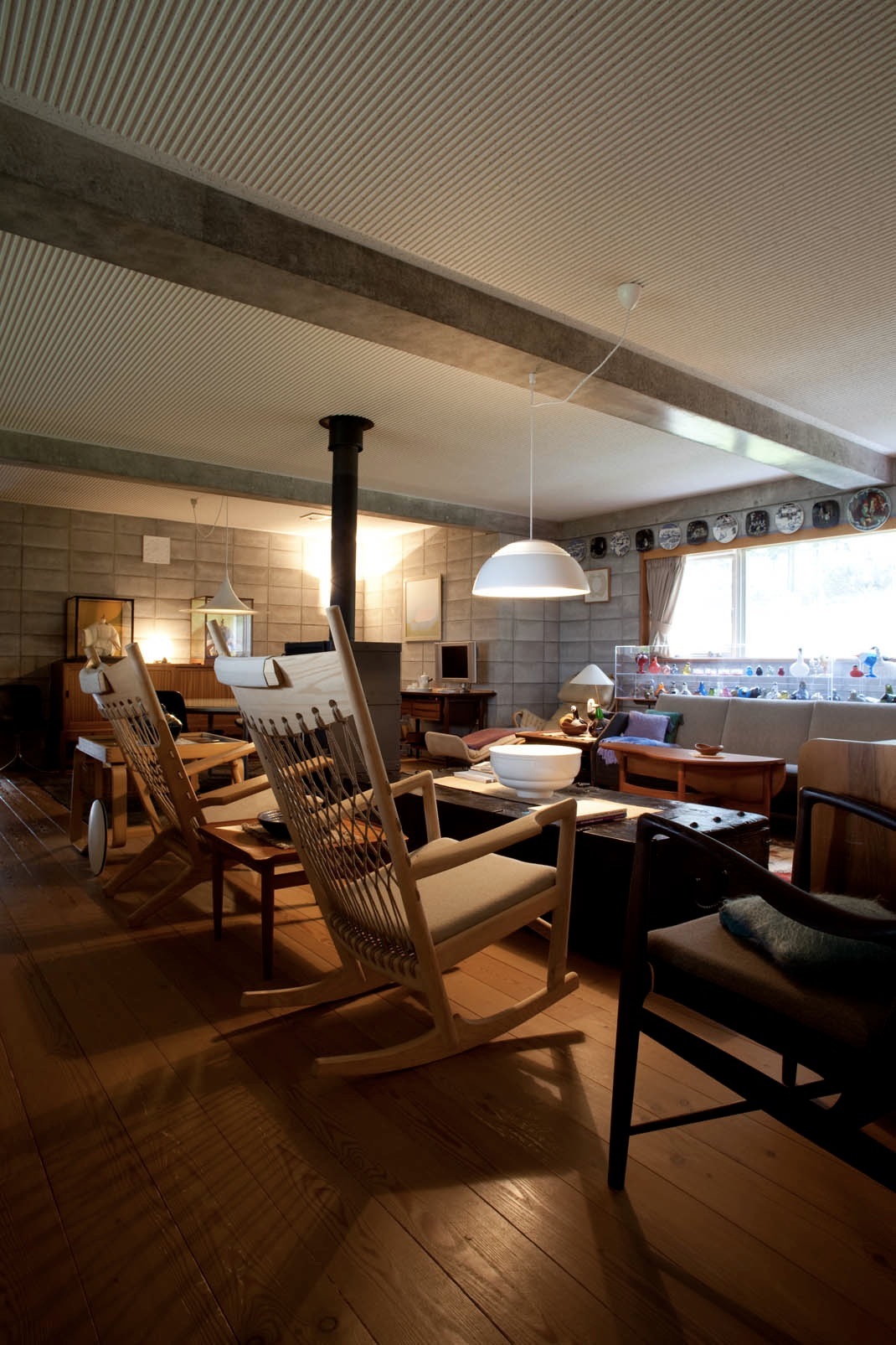 Interior of Noritsugu Oda's living room featuring Hans J Wegner Easy Chair and Rocking Chair among other Scandinavian furniture.