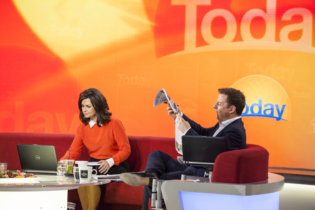 Lisa Wilkinson and Ben Fordham present Channel Nine's Today breakfast show on set with orange backdrop.