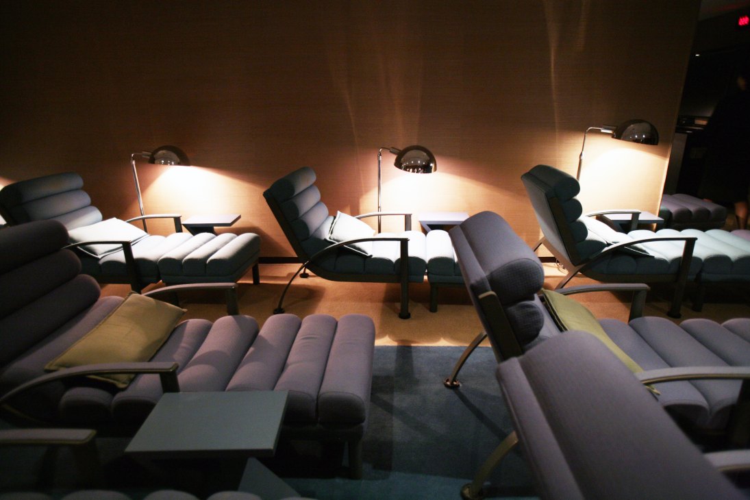 Spa lounge with relaxation chairs under warm accent lighting at Grand Hyatt Seoul.
