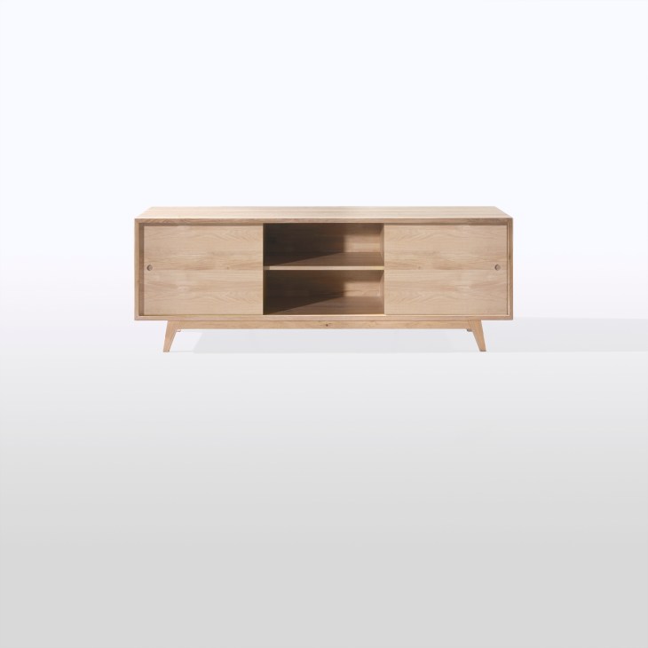Light wood sideboard with two cabinet doors and open shelving by design brand Wewood.