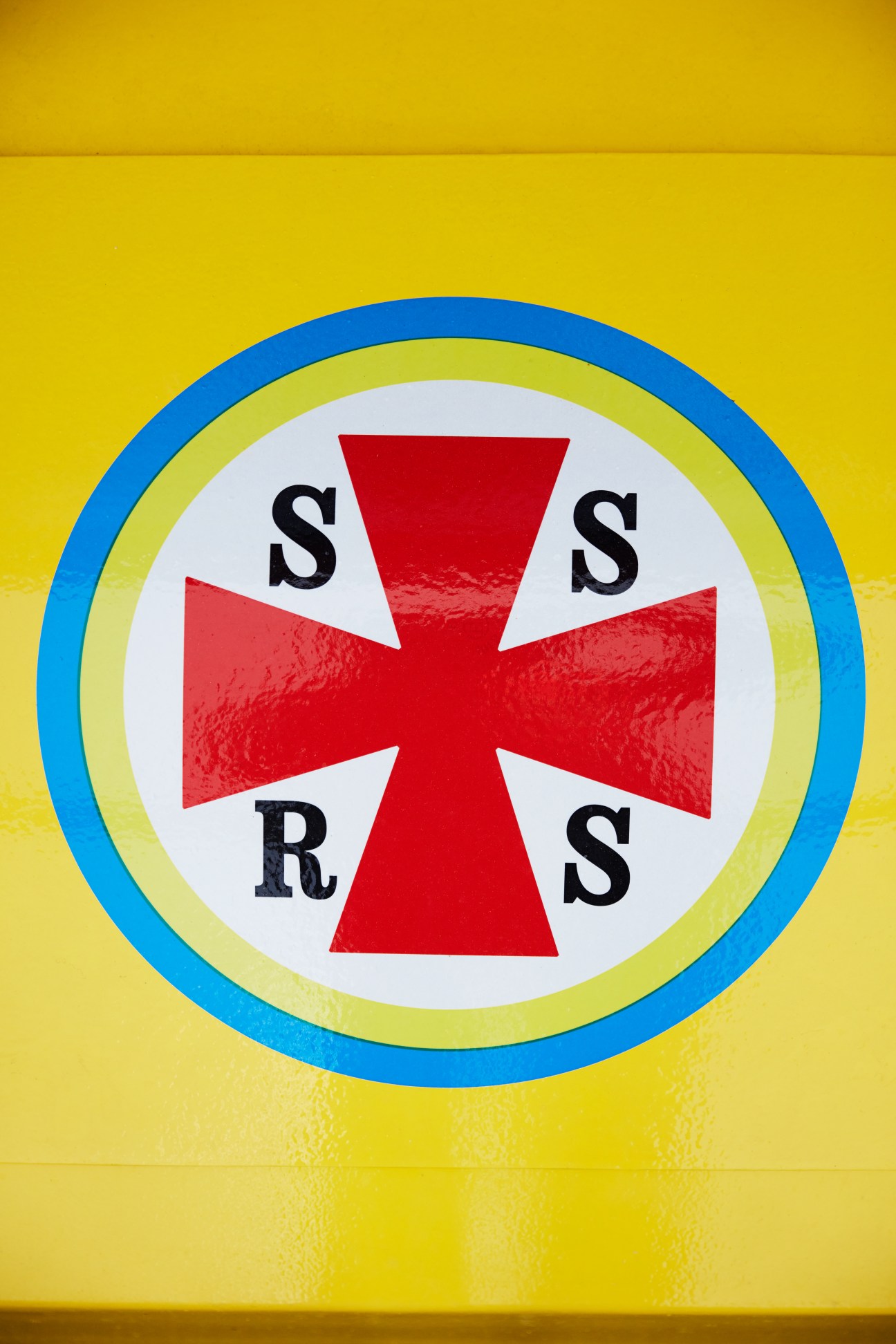 Swedish Sea Rescue Society logo featuring a red cross with S and R letters on concentric blue and yellow circles.
