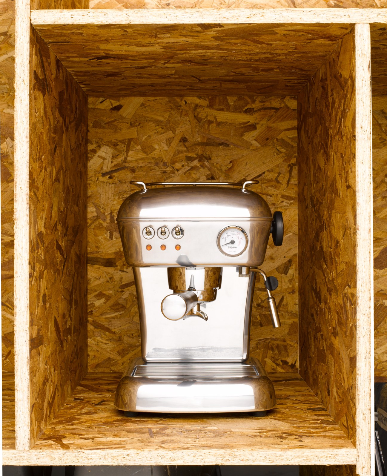 Ascaso Dream coffee machine with white and stainless steel finish displayed in a wooden box.