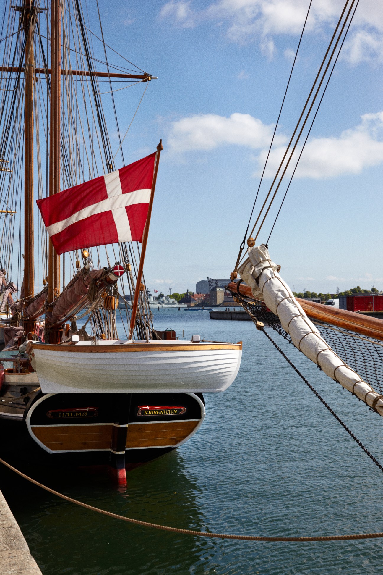 Traditional sailing ship with Danish flag moored in Copenhagen harbor