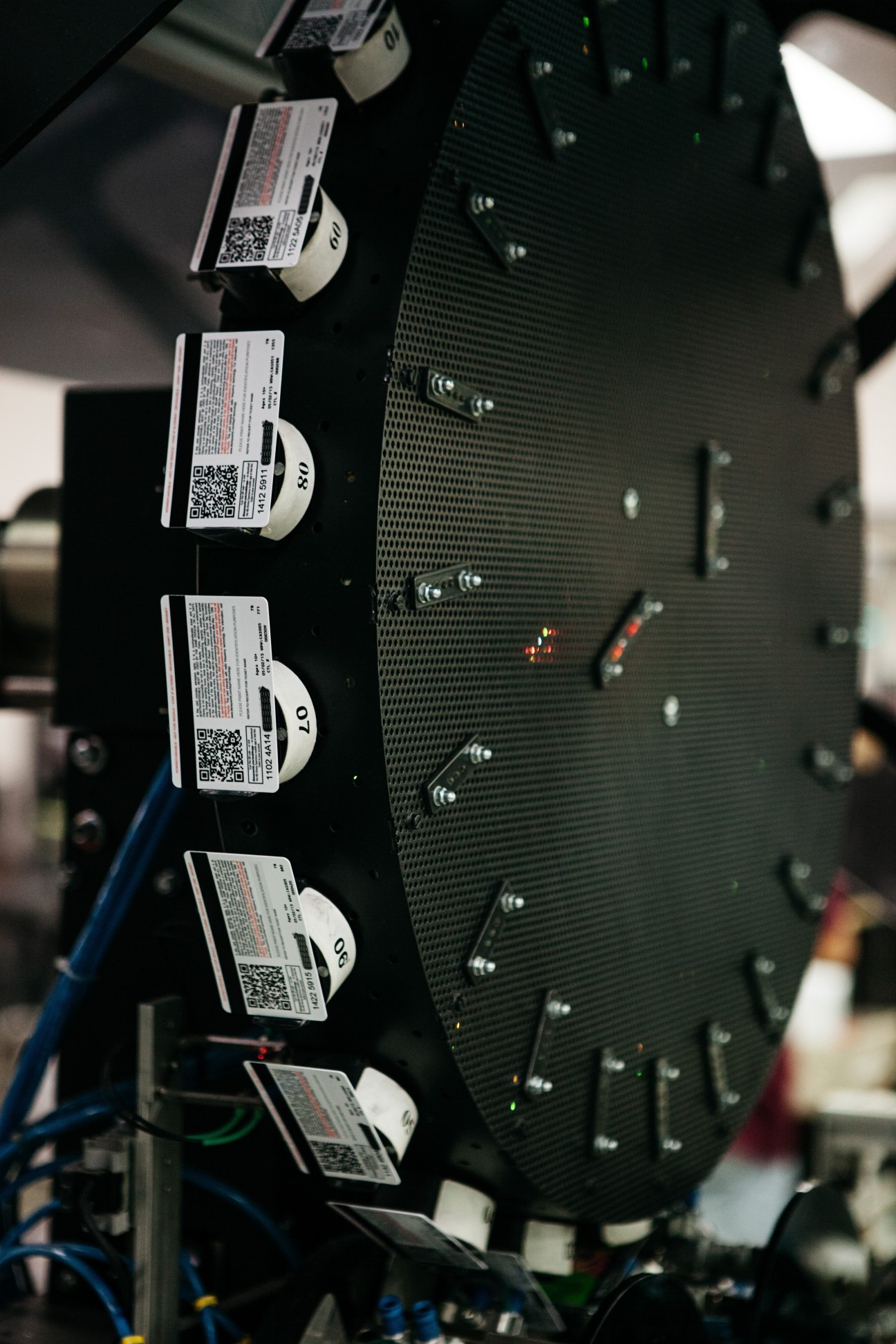 Credit cards with QR codes and security labels being programmed at CPI's manufacturing facility.