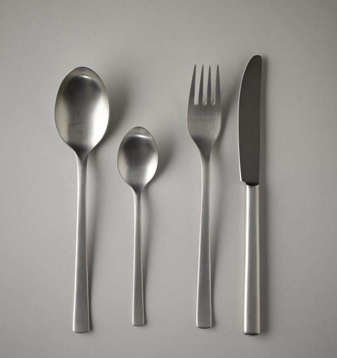 German Pott cutlery set displaying two spoons, a fork, and a knife in brushed stainless steel.