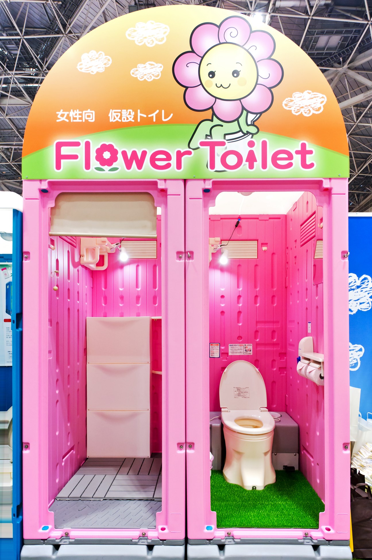 Pink prefabricated bathroom shelter with decorative dandelion flower pattern for female construction workers.