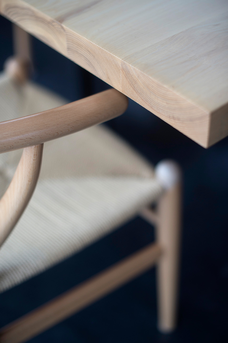 Close-up detail of Point House dining chair showing light wood grain and craftsmanship