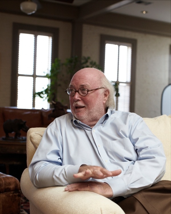 Fred Carl, founder of Viking Range Corporation, seated and speaking in an office setting.