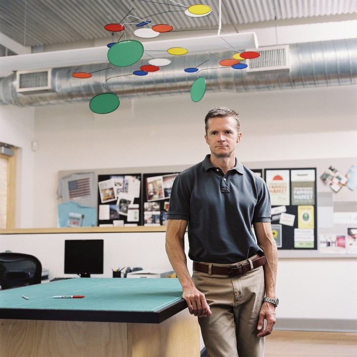 Brent Bailey, Viking's design director, stands in an office with a colorful mobile hanging above.