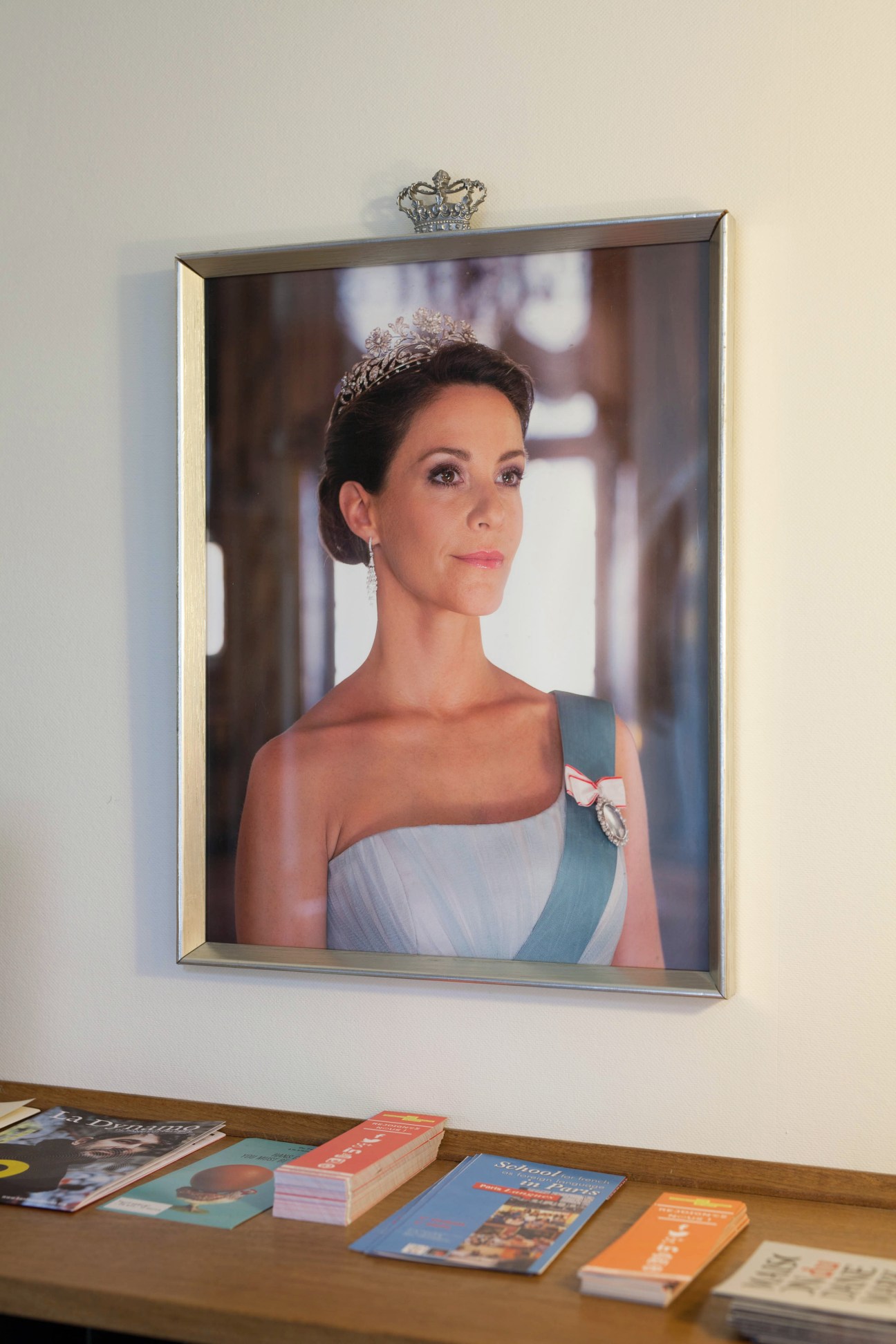 Framed portrait of Mary, Crown Princess of Denmark, wearing a tiara and formal attire with a blue sash and medal
