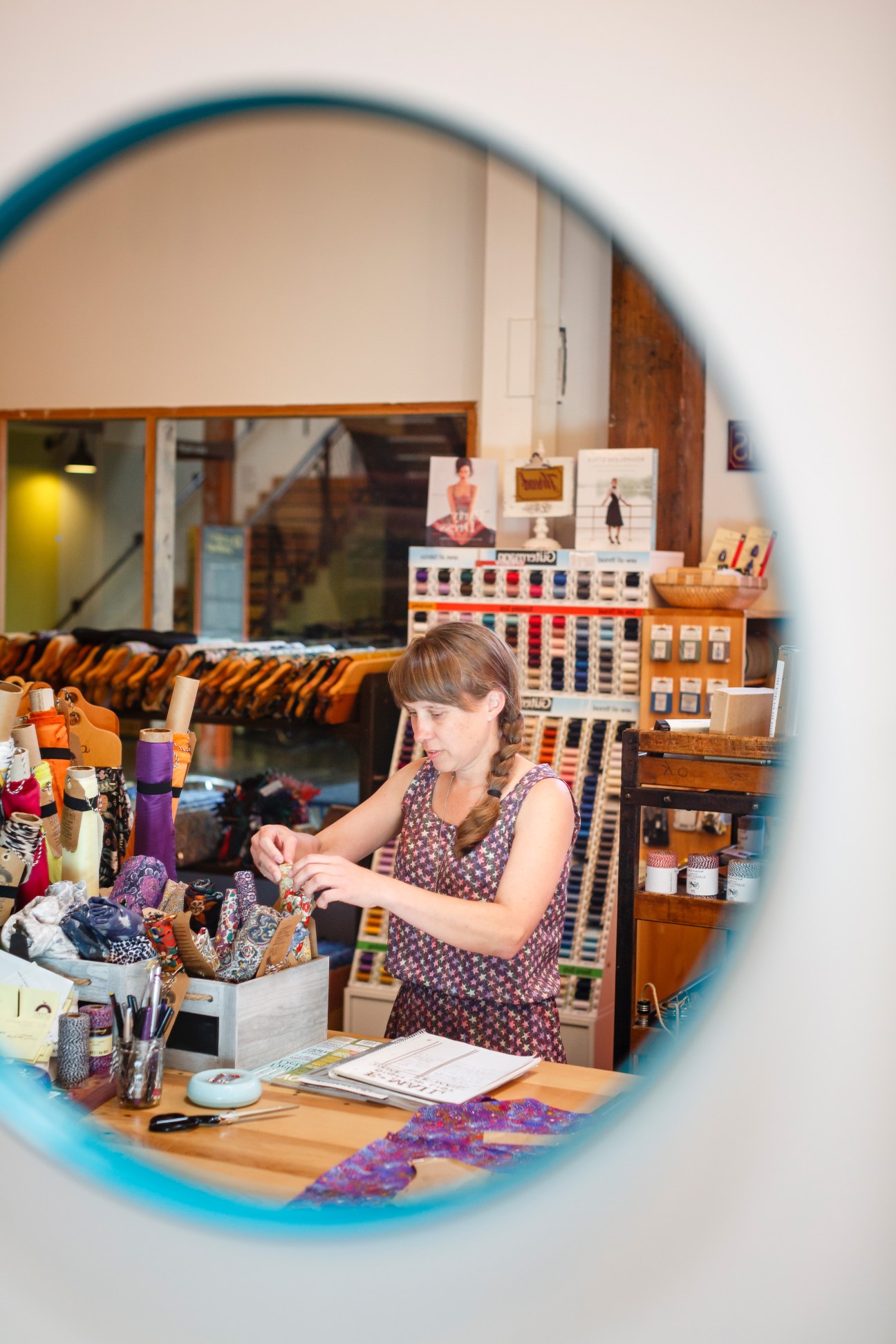Josephine's Dry Goods co-owner Bini Leach arranging fabric samples in her Portland shop.