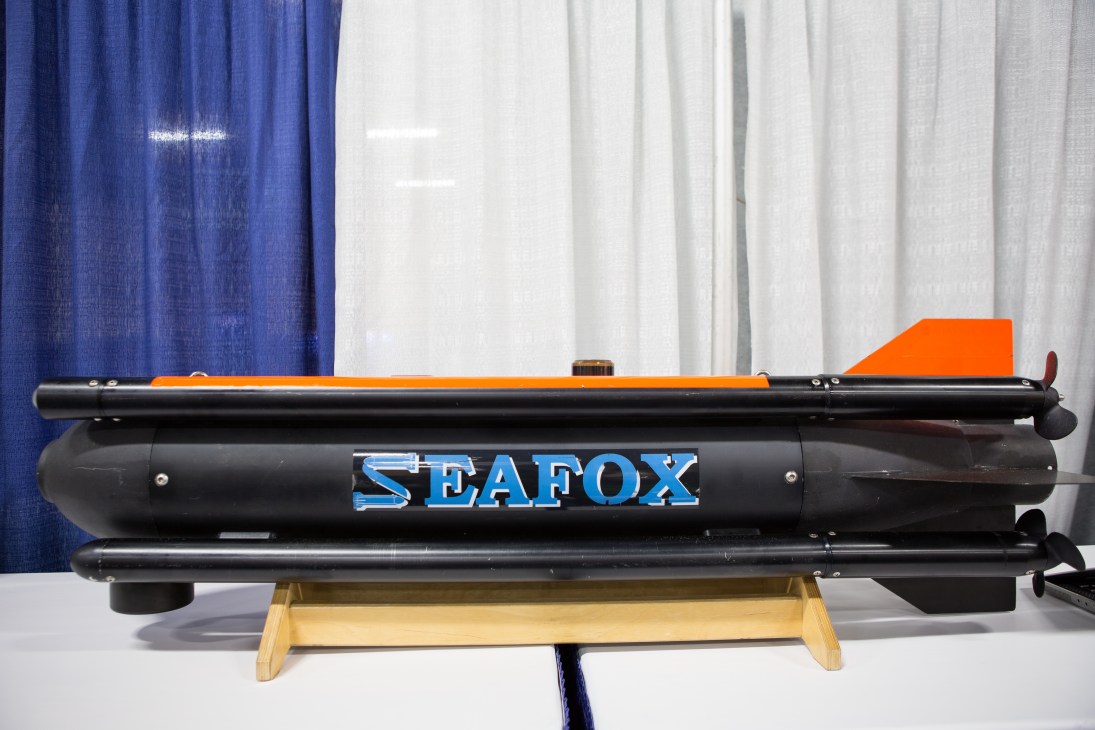 Atlas Elektronik UK submarine drone displayed on wooden stand at trade fair