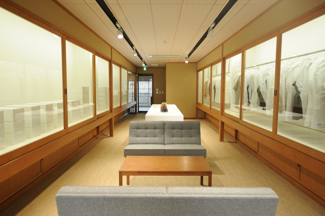 Interior of Free International Laboratory retail space in Tokyo showing wooden display cases and modern furnishings.