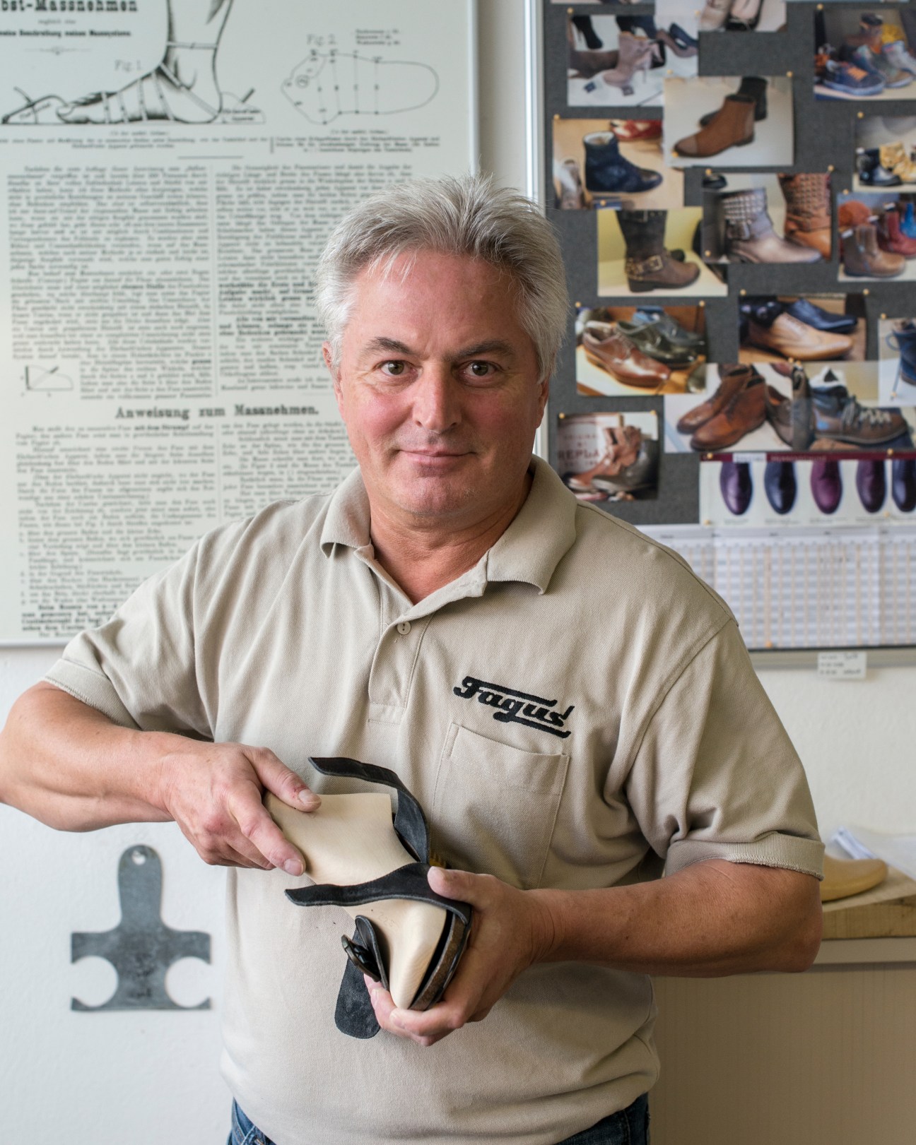 Bruno Henker, shoe-last pattern maker at Fagus factory, holds a wooden shoe last in his workshop.
