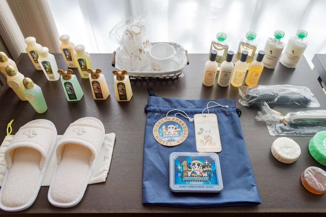 Hotel toiletries and amenities arranged on a table for hospitality training demonstration.