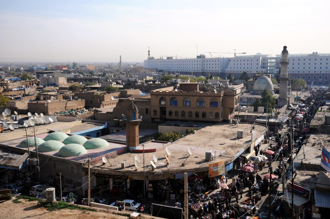 Aerial view of Arbil's old town centre showing historic buildings, bazaar, and modern structures in the background
