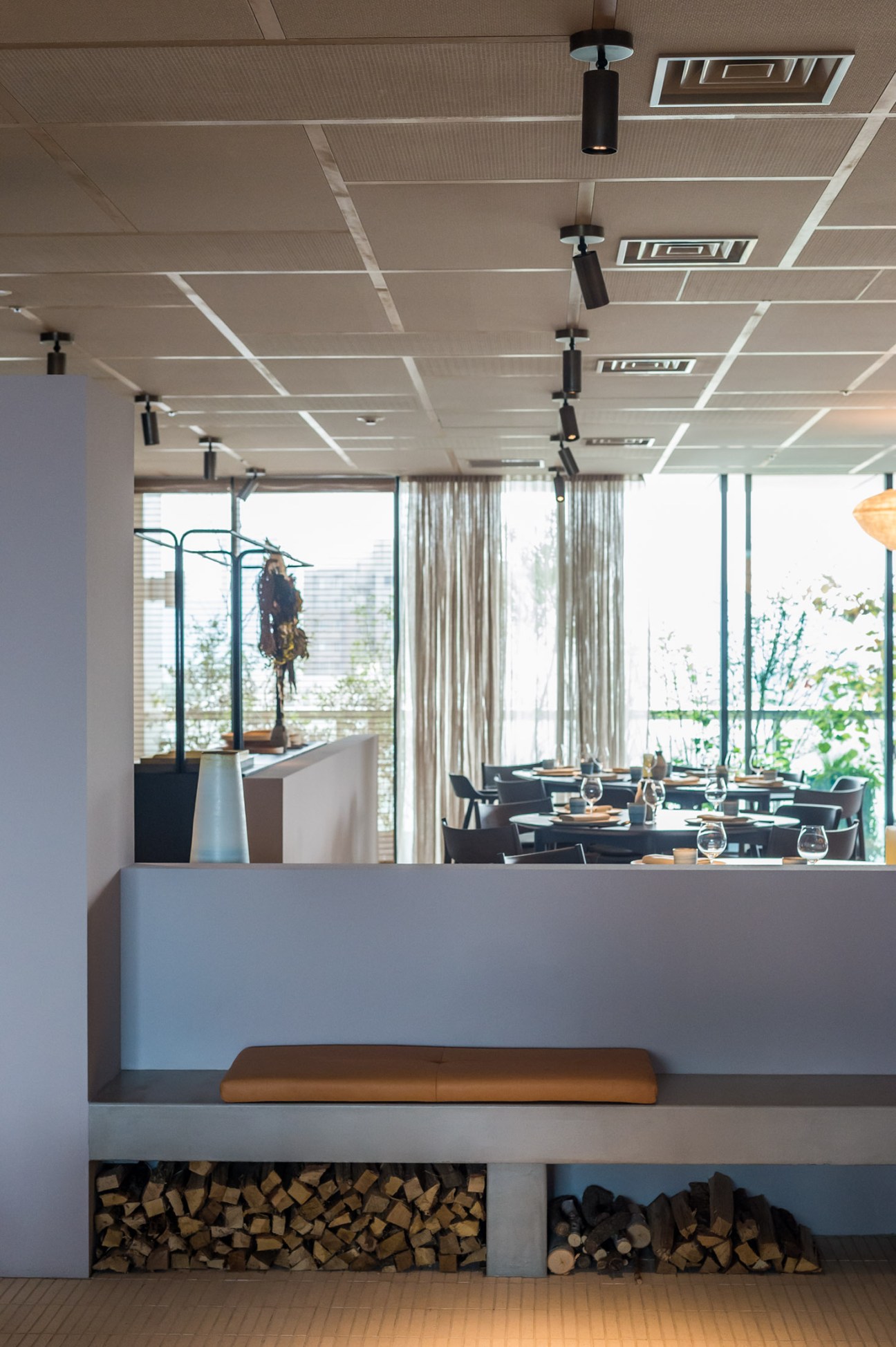 Restaurant entrance area featuring natural earth-toned design elements and textures