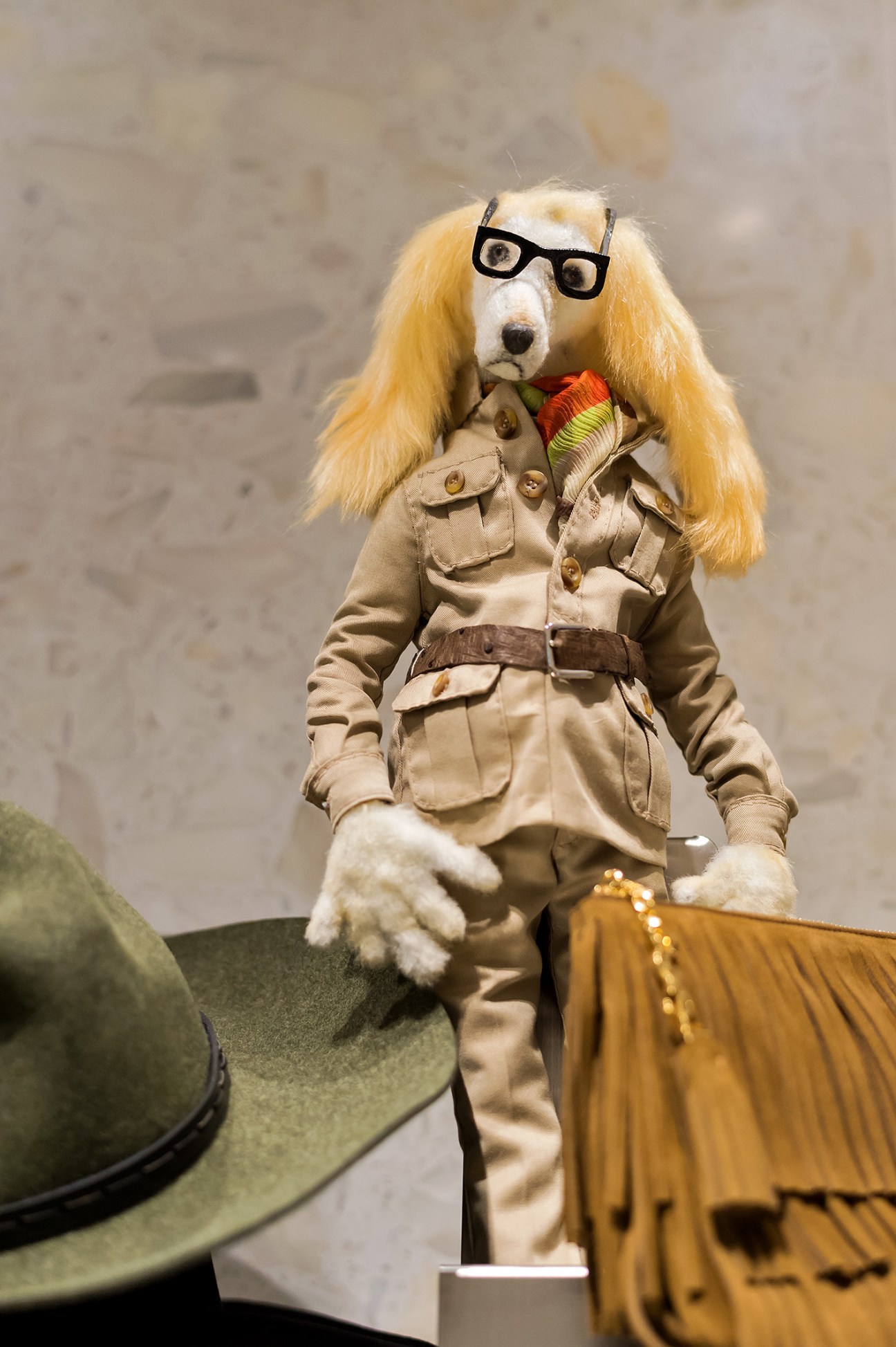Handmade dog figure wearing glasses, blonde wig and safari jacket by Shusaku Muramatsu