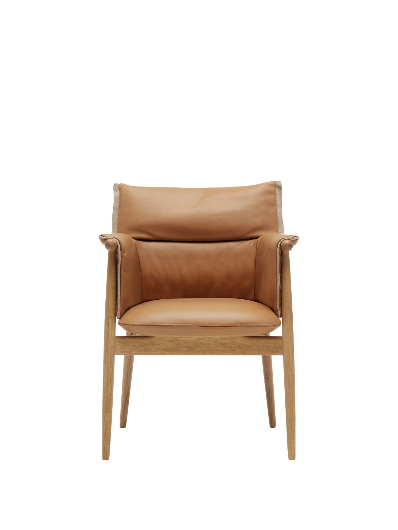 Wooden armchair with tan leather upholstery and armrests against a white background.