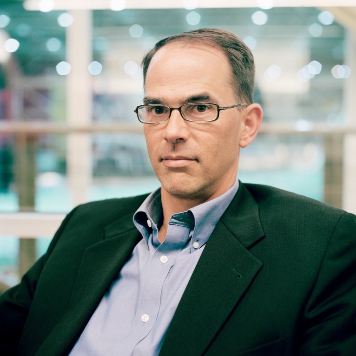 Bruce Dickinson, Boeing 747-8 vice president and chief project engineer, wearing glasses and a dark blazer.