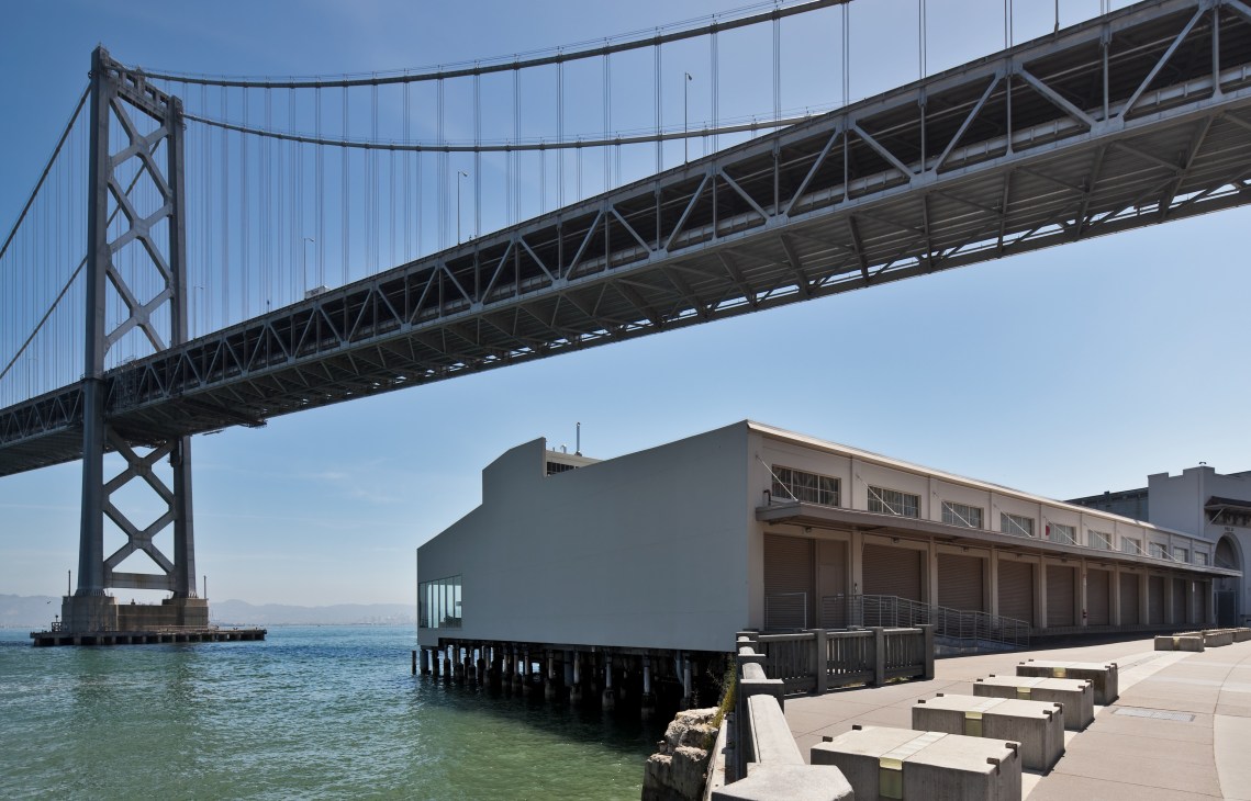 Pier 24 photography gallery exterior beneath the Bay Bridge in San Francisco with waterfront views.