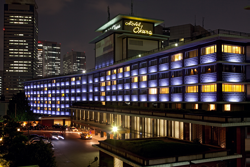 Hotel Okura's illuminated main wing at night, designed by Yoshiro Taniguchi and Hideo Kosaka, opened 1962.