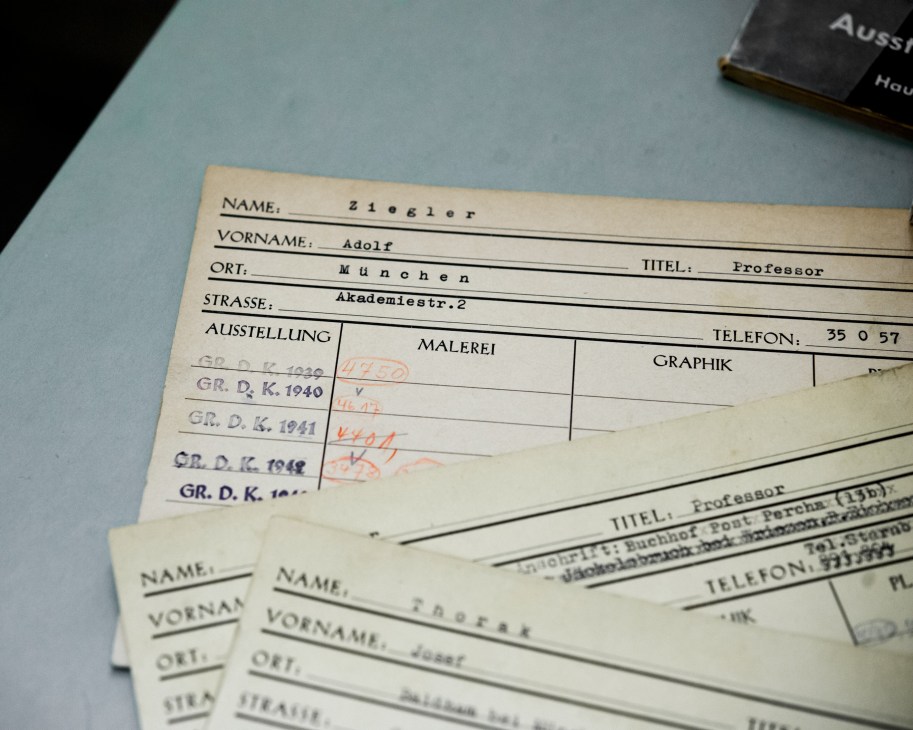 Historical Nazi-era registration documents with handwritten annotations stored in Haus der Kunst's archive.