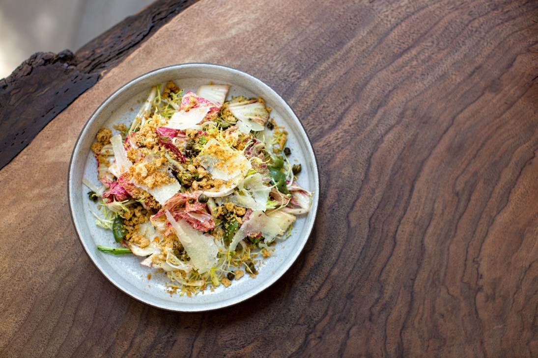 Squash and burrata salad with walnut purée, date caramel and crisp quinoa at Norah restaurant.