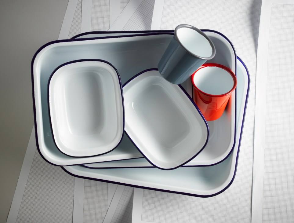 Falcon enamelware baking set with nested rectangular pans in white and blue trim, plus red and gray cups.