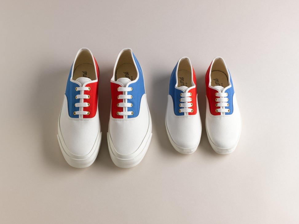 Four white canvas sneakers with blue and red colorblock uppers and white laces displayed on a neutral background.