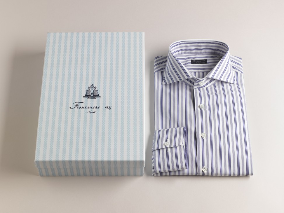 Finamore striped dress shirt next to light blue striped packaging box with brand logo