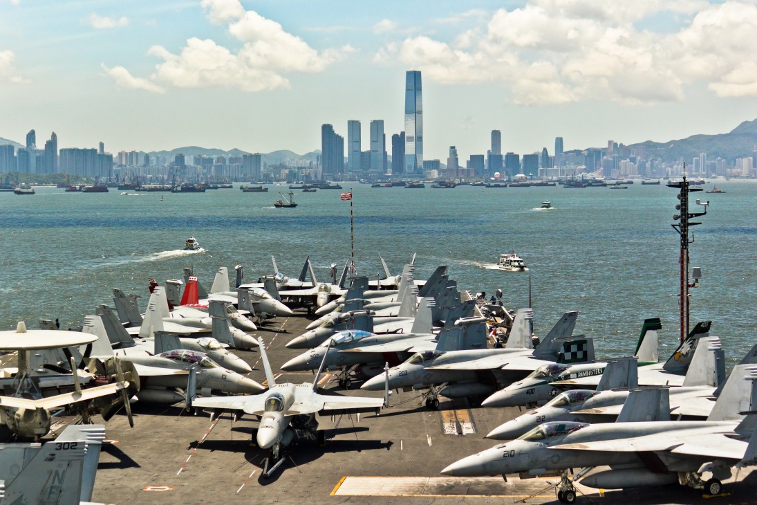 USS George Washington flight deck packed with F/A-18 fighter jets in Hong Kong harbour.