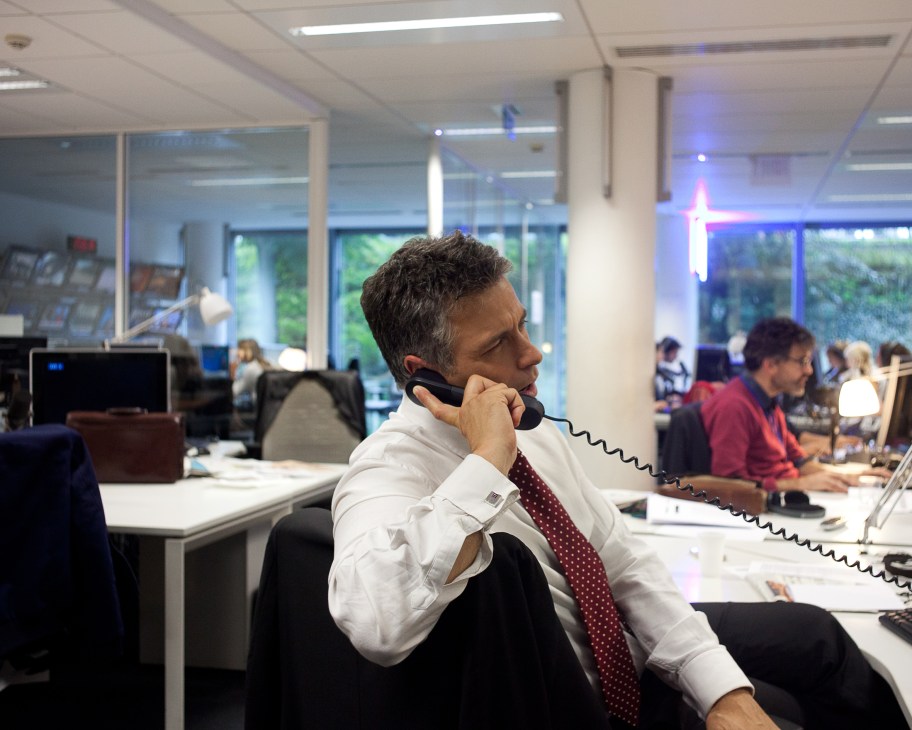 François Picard on phone in France 24 newsroom office