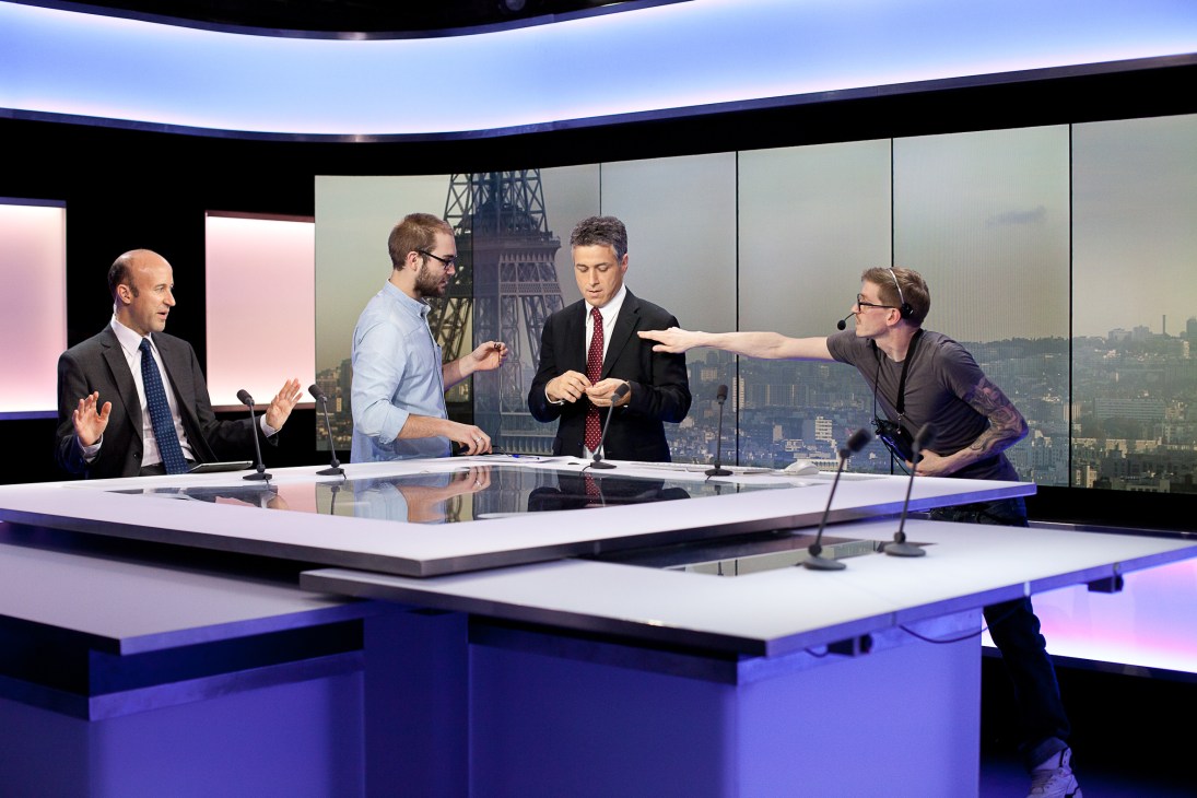 François Picard at France 24 news desk seconds before going live on air with colleagues