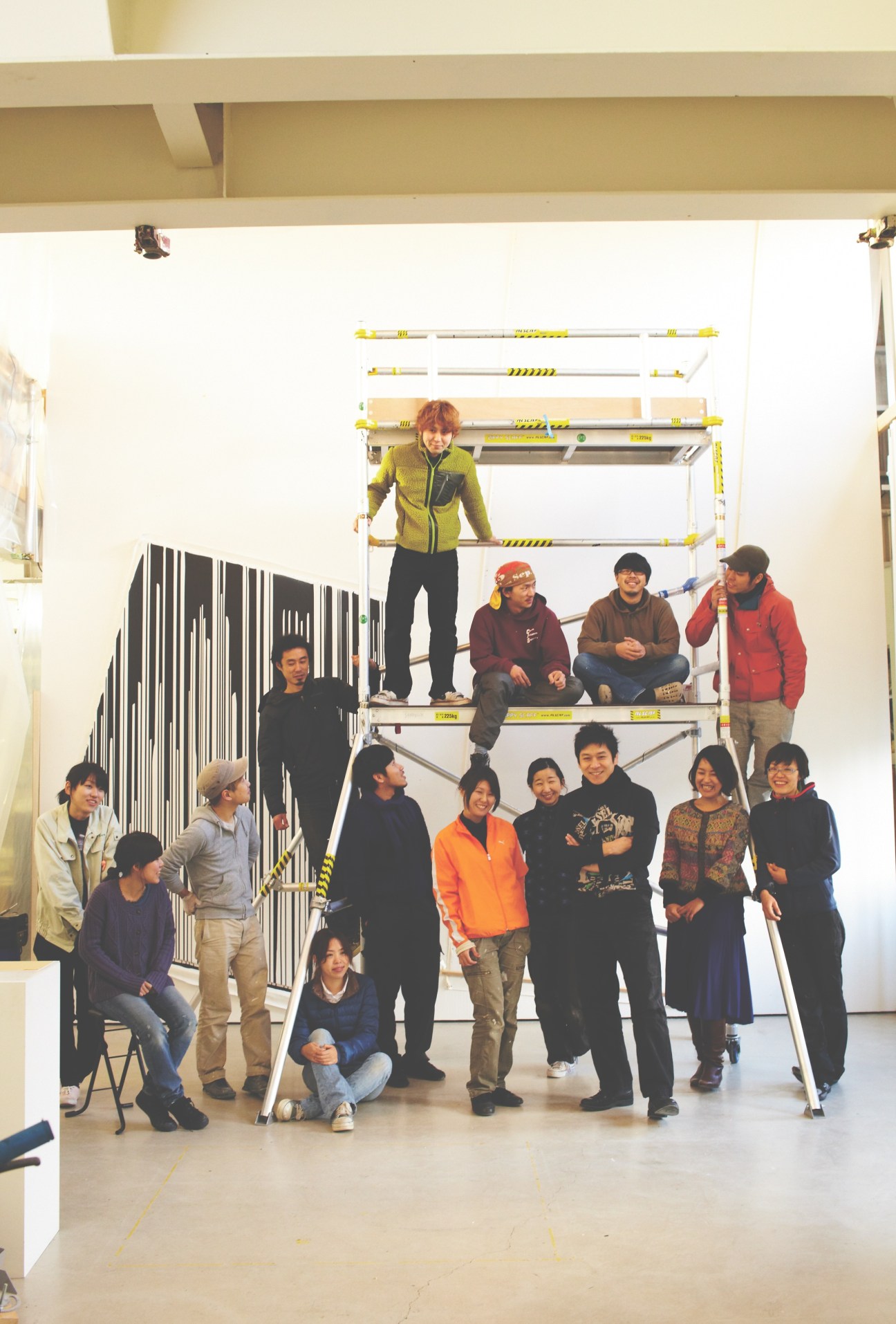 Kohei Nawa's Sandwich creative team posed together on scaffolding in their Kyoto studio.