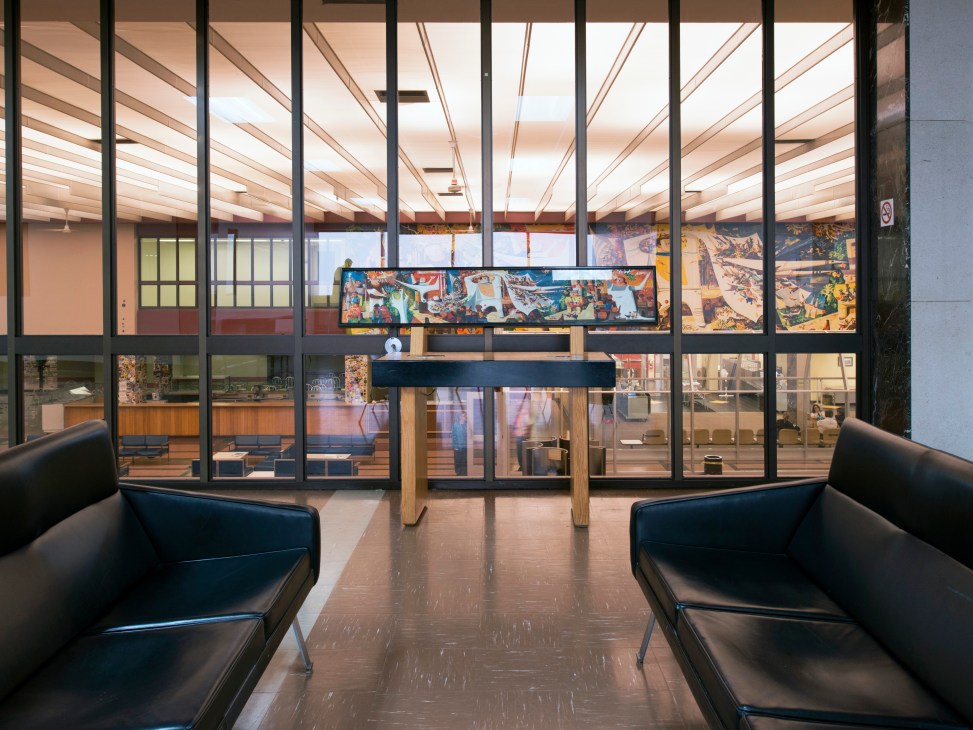 Gander Airport's viewing area with black leather Christen Sorensen armchairs facing large windows overlooking the mural by Kenneth Lochhead.