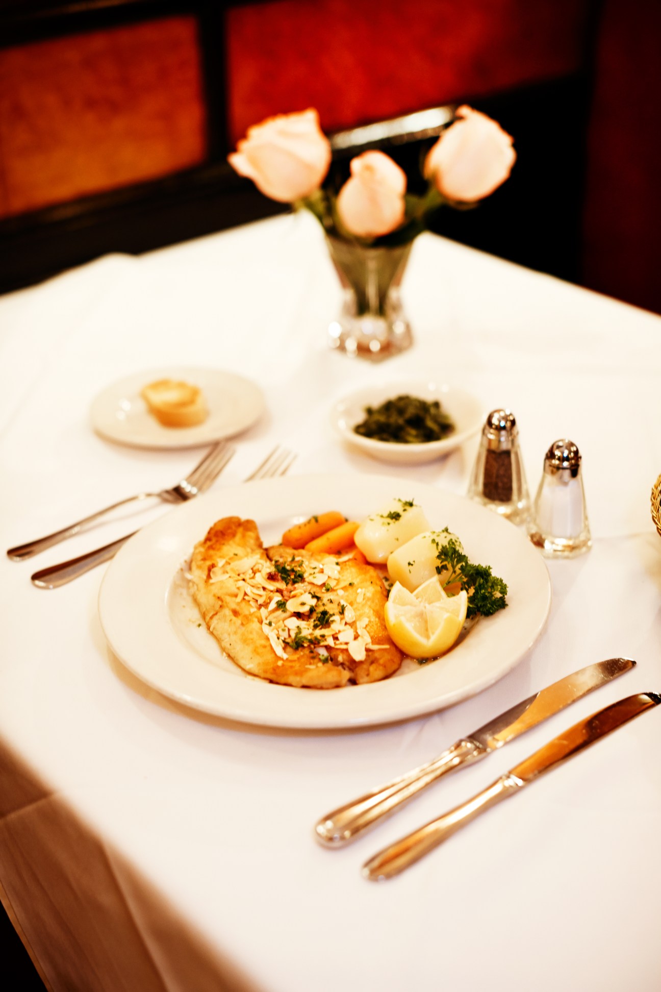 Fillet of sole with almonds, lemon, boiled potatoes and sautéed spinach at Le Veau d'Or restaurant.