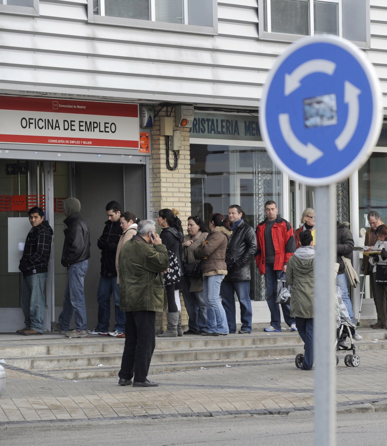 People queuing outside a Spanish employment office in Madrid during the 2010 financial crisis.