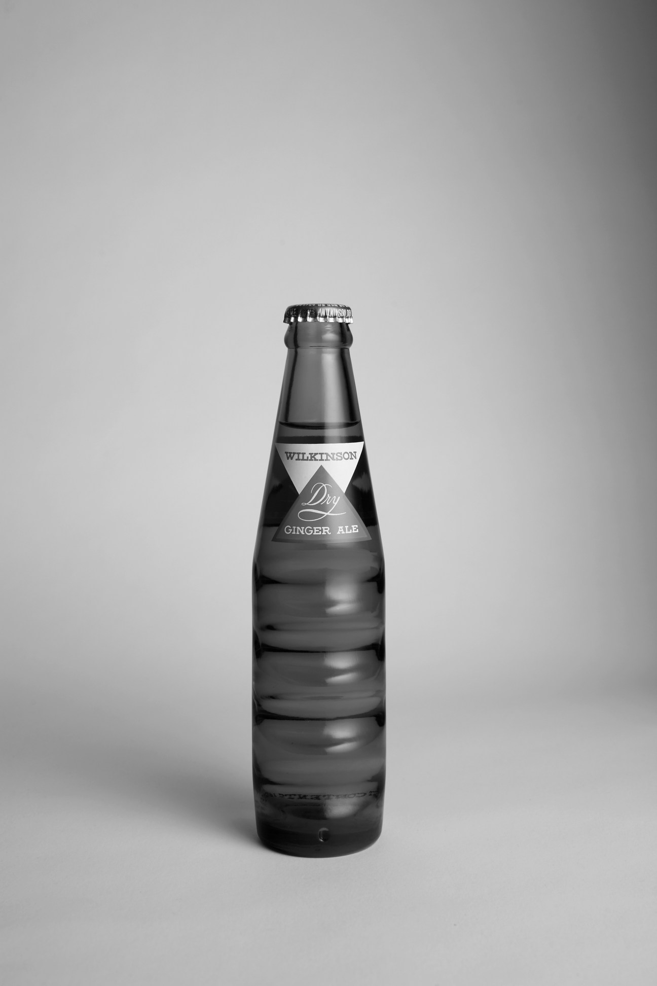 Wilkinson Dry Ginger Ale bottle in black and white photography.