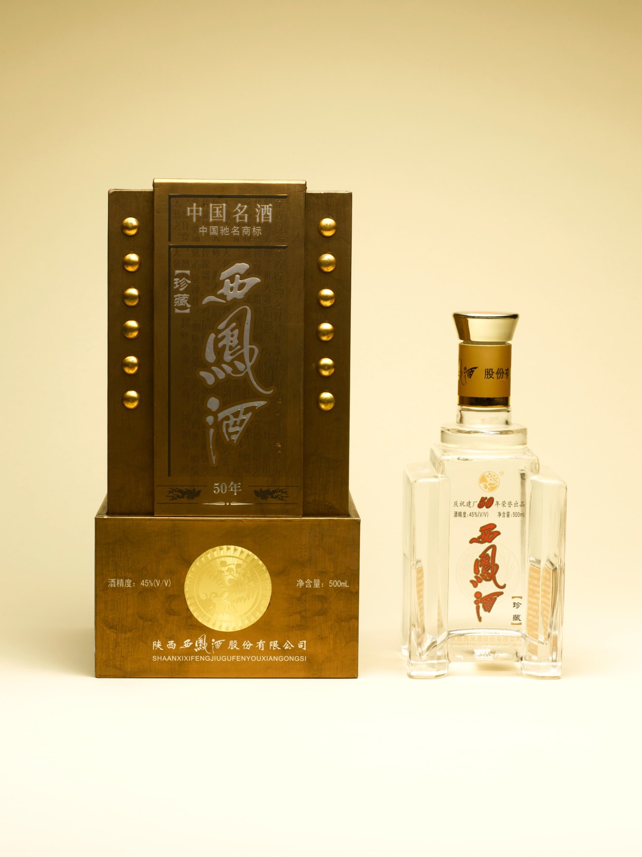 Shaanxi West Phoenix Spirits bai jiu bottle with mid-century communist architecture-inspired design in rivet-covered wooden case.