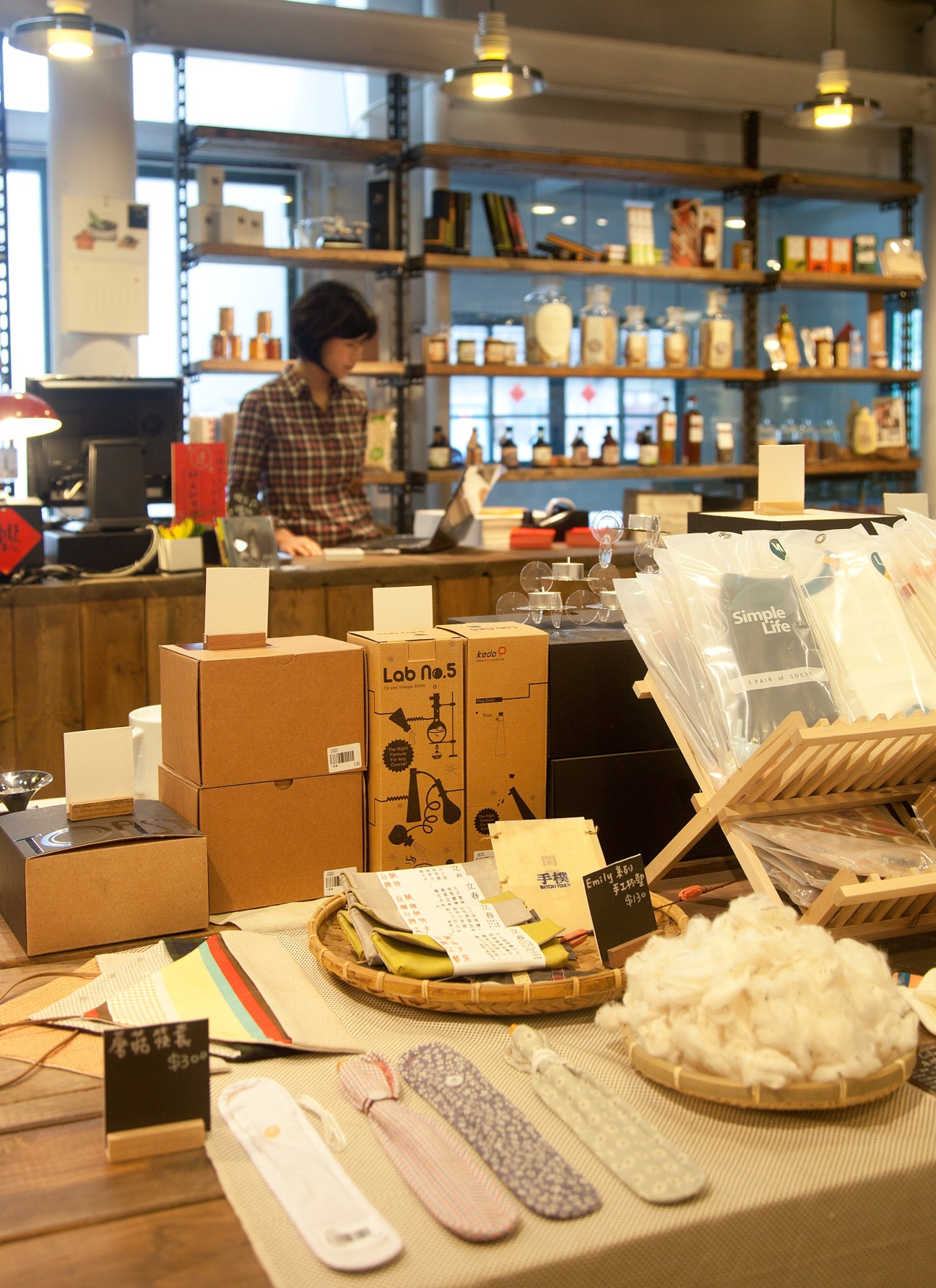 Good Cho's café interior in Taipei with vintage shelving, local products, and counter display.