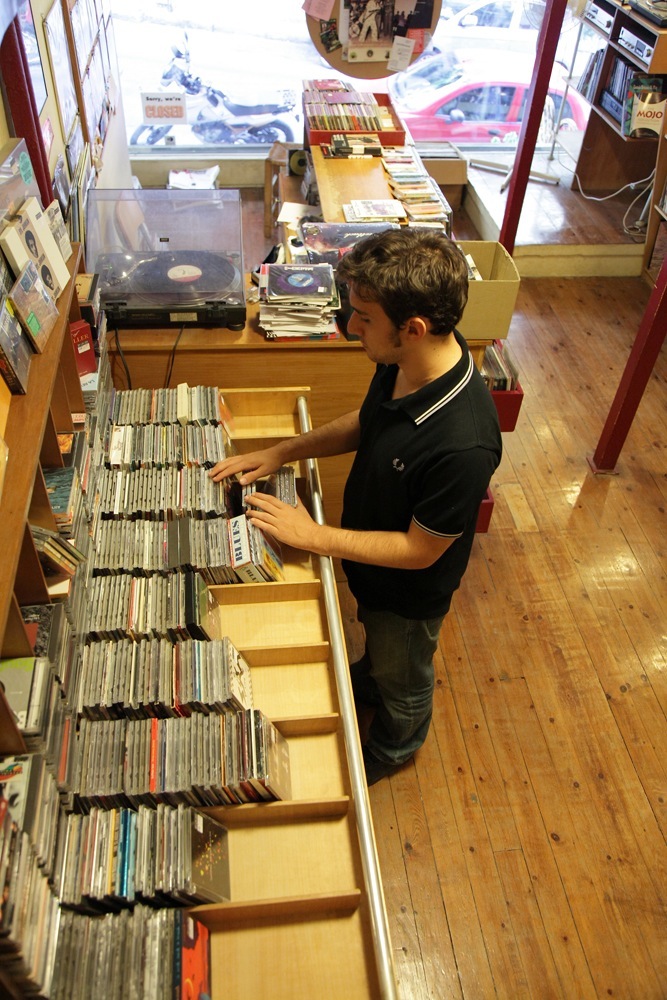 A customer browses vinyl records at Rock & Roll Circus record shop in Athens.